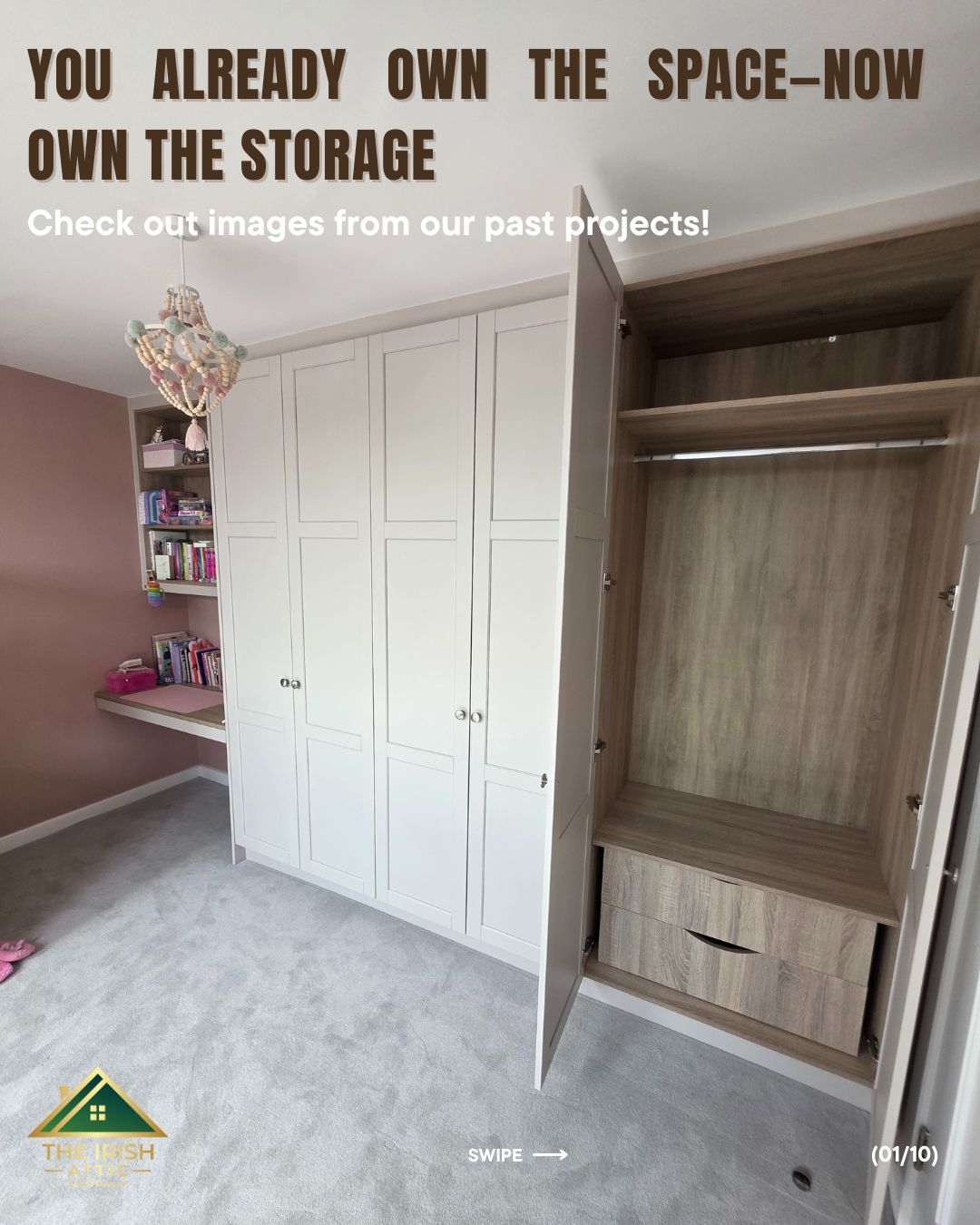 Fitted attic wardrobe with open doors and integrated shelving in a pink attic bedroom