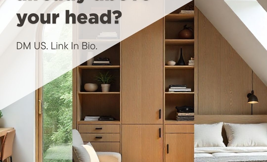 Calm attic bedroom with built-in wooden storage, shelving, and drawers under sloped ceilings, filled with natural light from skylight windows.