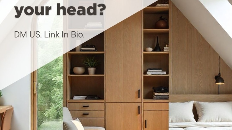 Calm attic bedroom with built-in wooden storage, shelving, and drawers under sloped ceilings, filled with natural light from skylight windows.